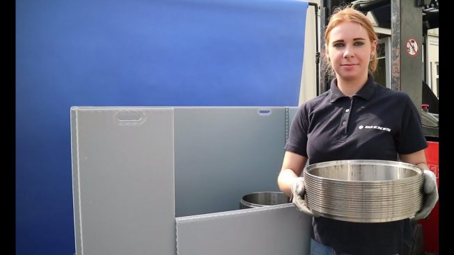 A DIENES employee with circular knives removed from the knife transport box.