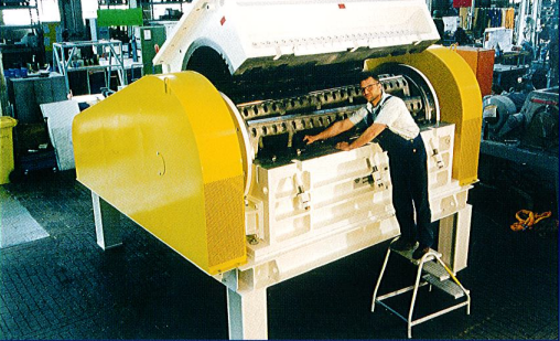 An opened granulator with machine operator