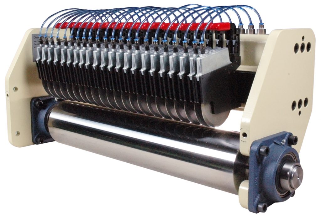 A DIENES slitting system with the crush cut slitting cassette and the Quick Clamp.