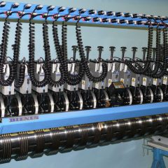 Slitting system module II-S from DIENES with grooved knives and a bottom knife shaft.